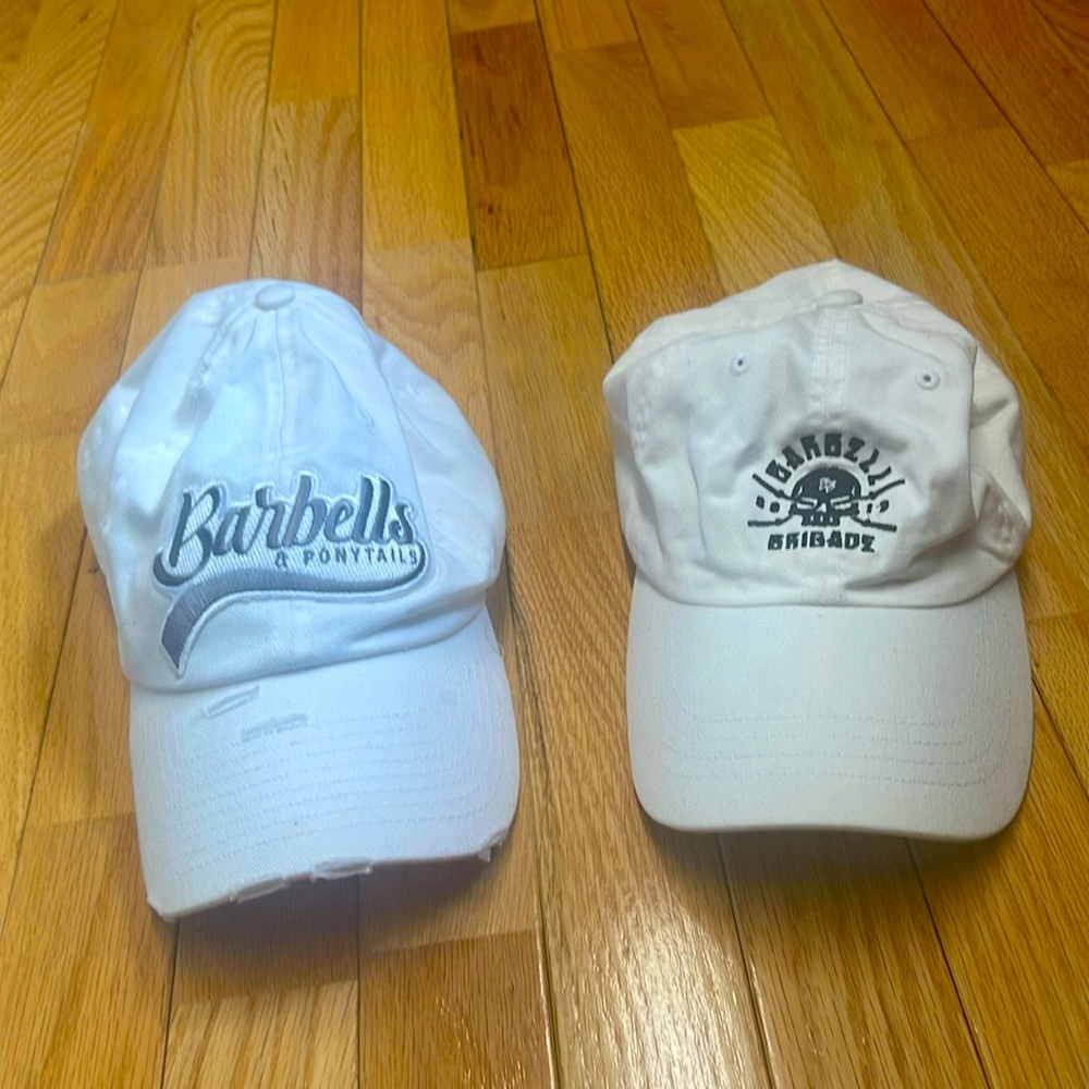 TWO Women’s White Lifting Hats- Barbell Brigade Barbells & Ponytails